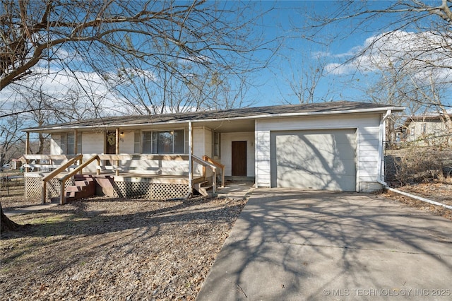 ranch-style home with a garage and covered porch