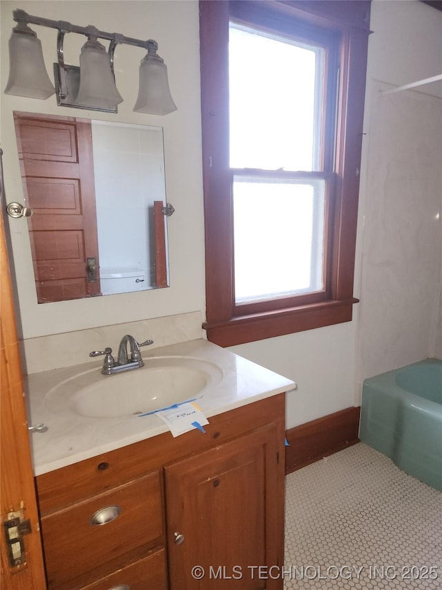 bathroom with vanity and a bathing tub