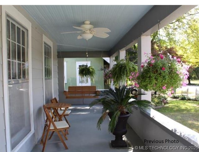 exterior space featuring ceiling fan