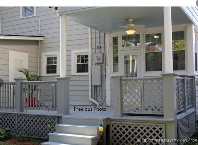 doorway to property featuring ceiling fan