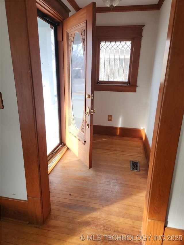 doorway to outside with light hardwood / wood-style floors