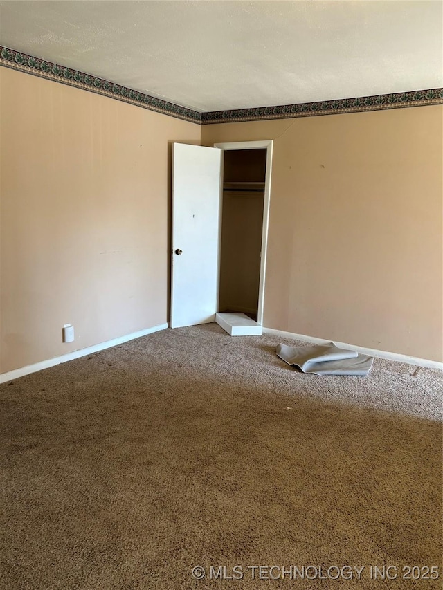 unfurnished bedroom with carpet and a closet