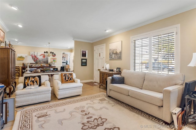 living room with a notable chandelier, light hardwood / wood-style flooring, and ornamental molding