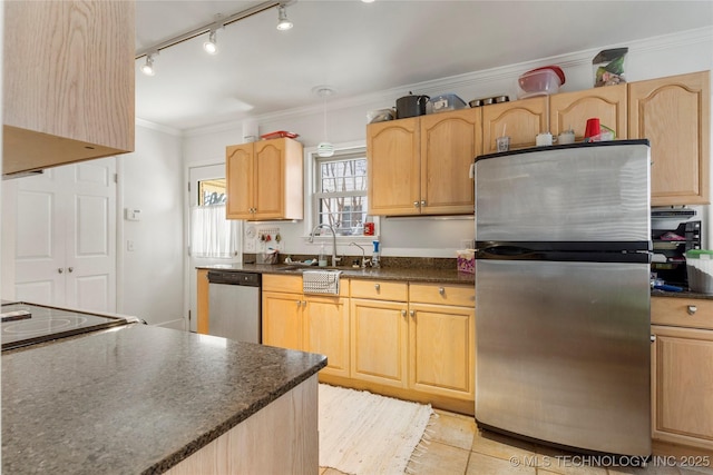 kitchen with sink, ornamental molding, light brown cabinets, and appliances with stainless steel finishes