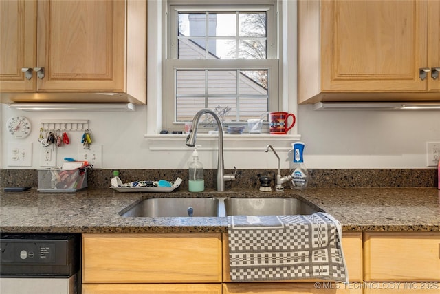 kitchen with sink, light brown cabinets, black dishwasher, and stone counters