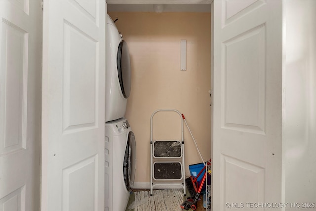 laundry room featuring stacked washing maching and dryer