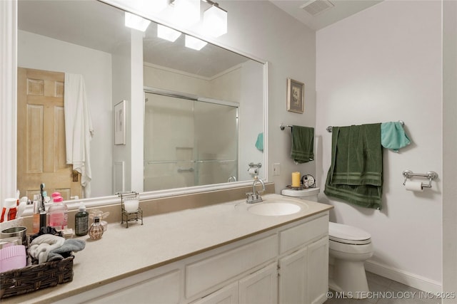 bathroom featuring an enclosed shower, vanity, tile patterned floors, and toilet