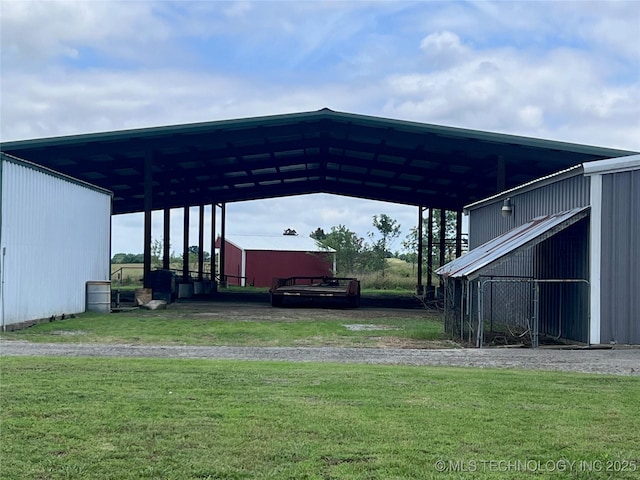 view of parking with a lawn