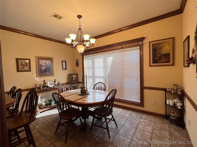 tiled dining area with crown molding and a notable chandelier