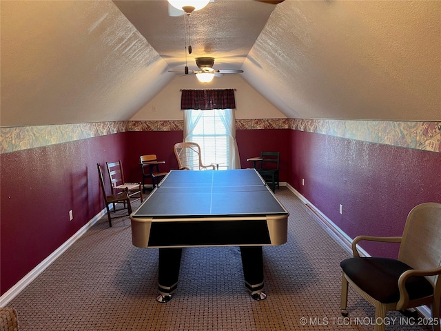 playroom with lofted ceiling, carpet flooring, and a textured ceiling