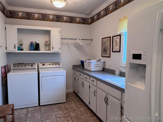 washroom with sink, cabinets, separate washer and dryer, light tile patterned floors, and ornamental molding