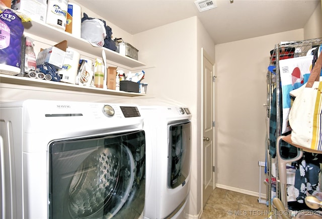 washroom featuring independent washer and dryer