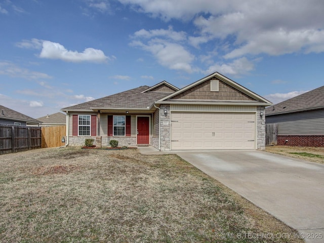 ranch-style home with a garage and a front yard