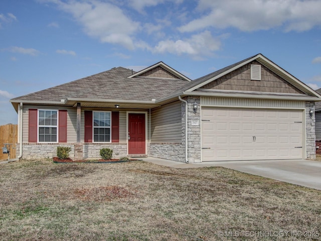 view of front of home with a garage and a front lawn