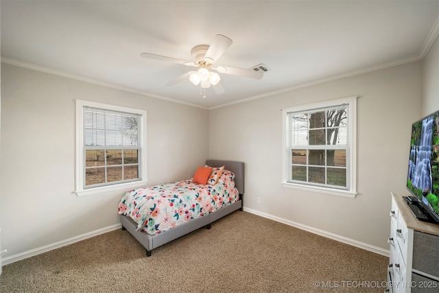 bedroom featuring carpet floors, ornamental molding, and ceiling fan