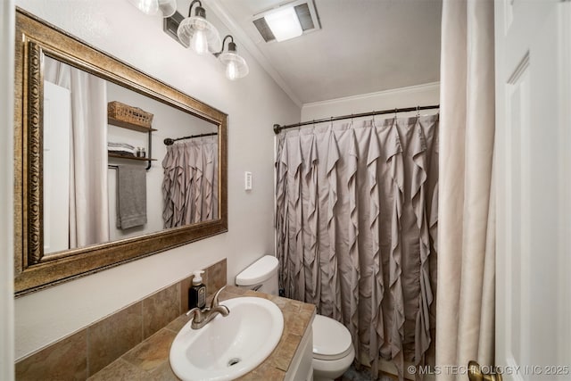 bathroom featuring a shower with curtain, ornamental molding, toilet, and vanity