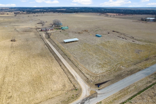 birds eye view of property with a rural view