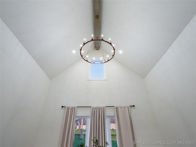 interior details featuring an inviting chandelier