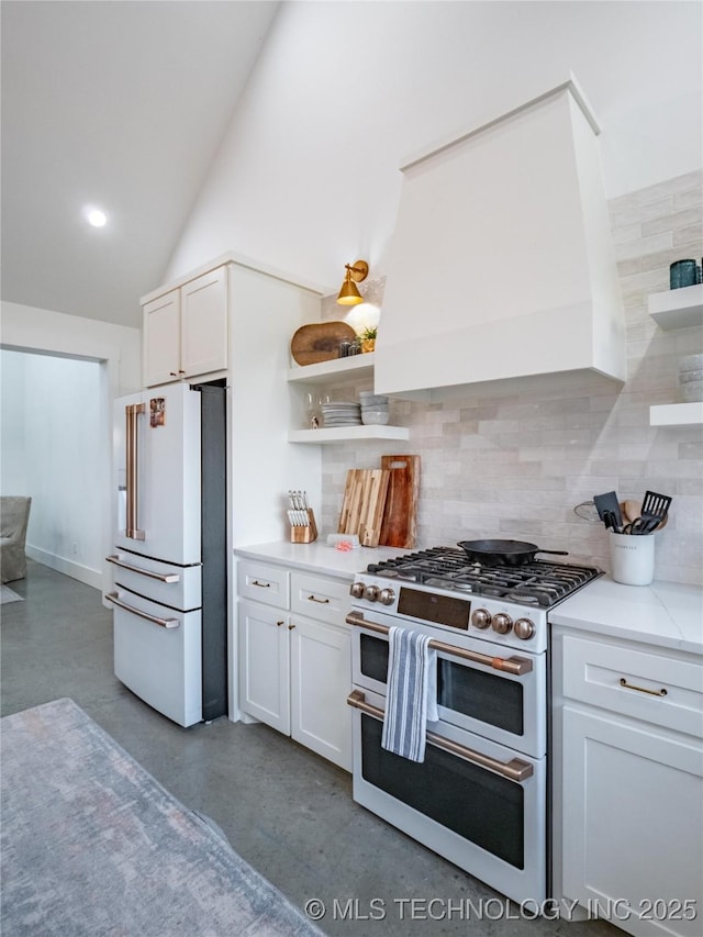 kitchen featuring high end appliances, backsplash, custom exhaust hood, and white cabinets