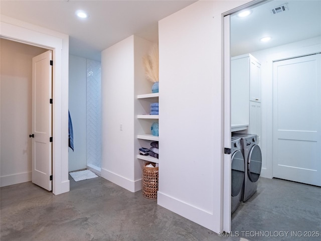 laundry area featuring cabinets and independent washer and dryer