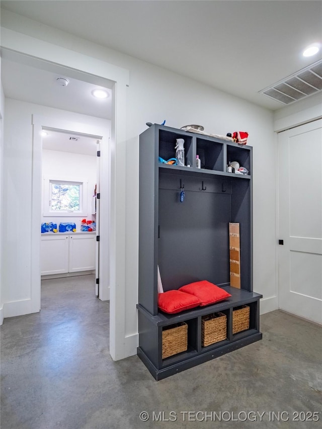 mudroom featuring concrete floors