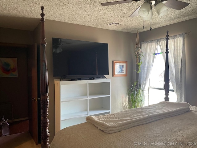 unfurnished bedroom with ceiling fan and a textured ceiling