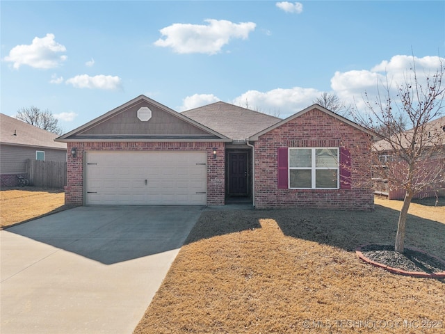 single story home featuring a garage and a front lawn