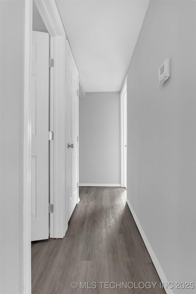 corridor featuring dark hardwood / wood-style floors