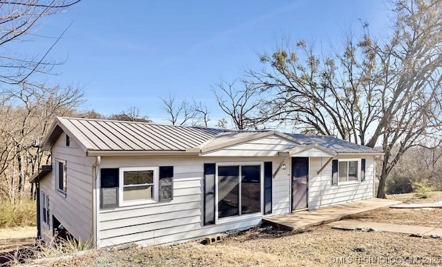 rear view of house with a patio