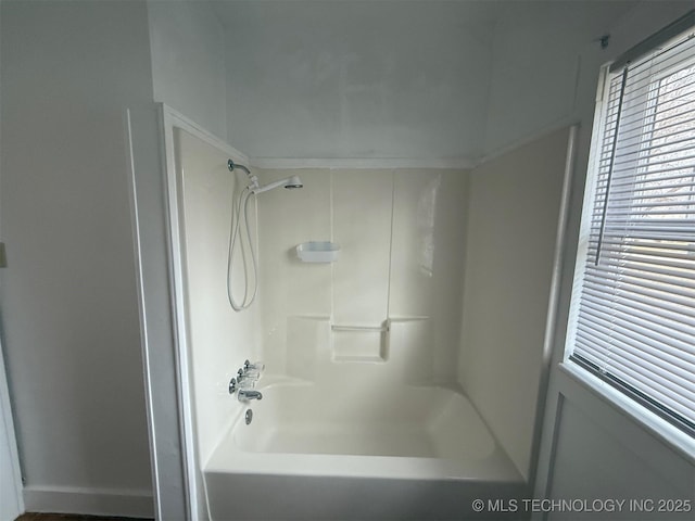 bathroom with washtub / shower combination