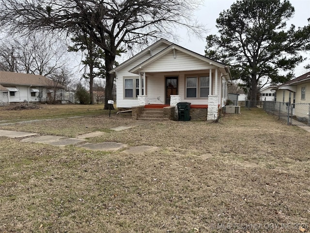 bungalow-style house with a front lawn