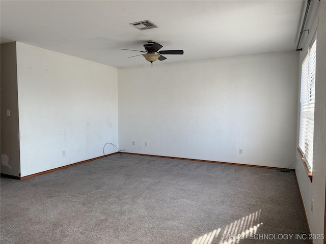 spare room with ceiling fan, carpet floors, and a healthy amount of sunlight