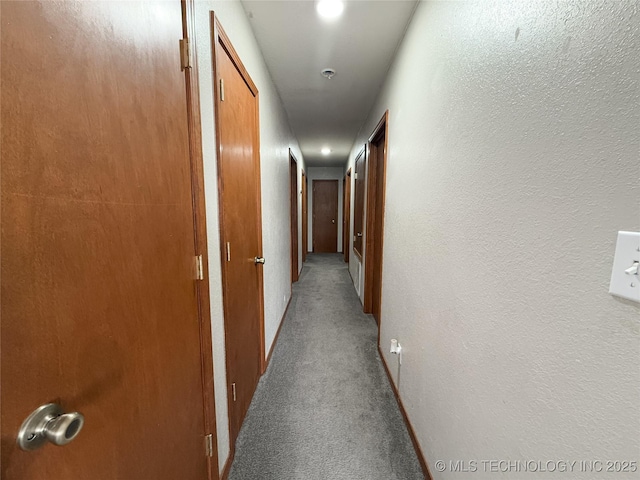 hallway featuring light carpet