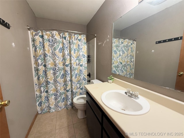 bathroom with tile patterned floors, toilet, curtained shower, and vanity