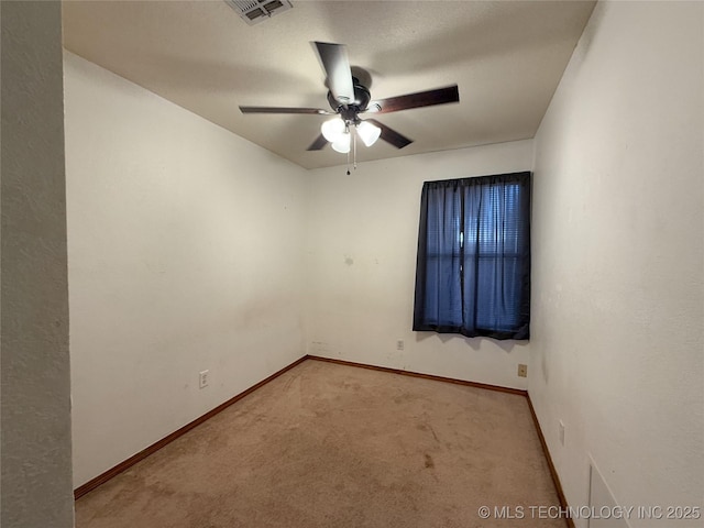 spare room with carpet flooring, a textured ceiling, and ceiling fan