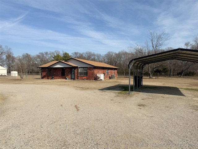 exterior space with a carport