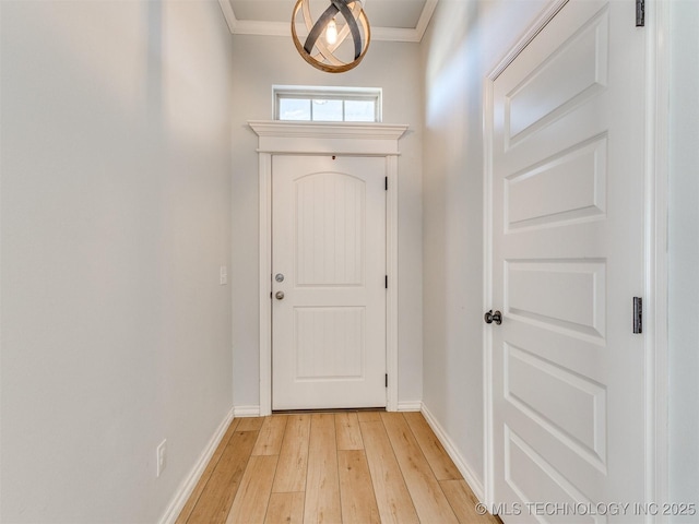 doorway featuring crown molding and light wood-type flooring