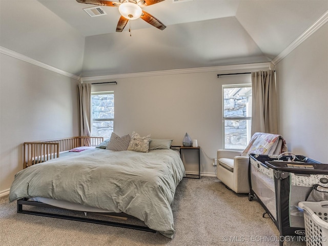 bedroom featuring multiple windows, ceiling fan, vaulted ceiling, and light carpet