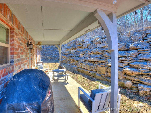 view of patio with a grill