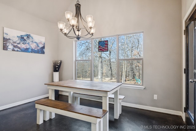 dining space with an inviting chandelier