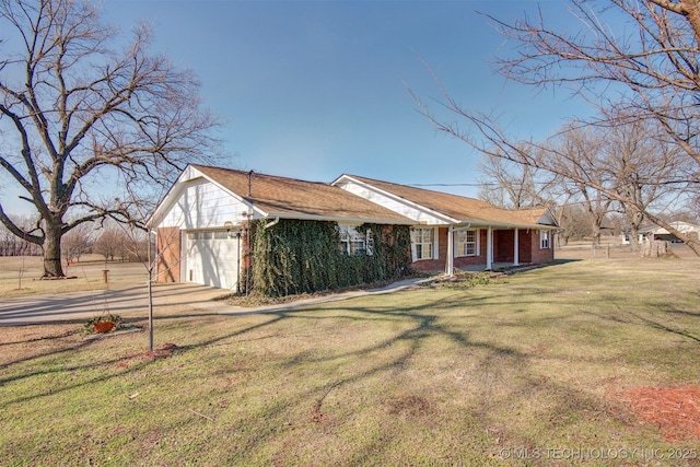 view of front of house with a garage and a front lawn