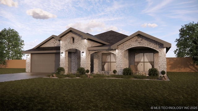 french country home featuring a garage and a front yard