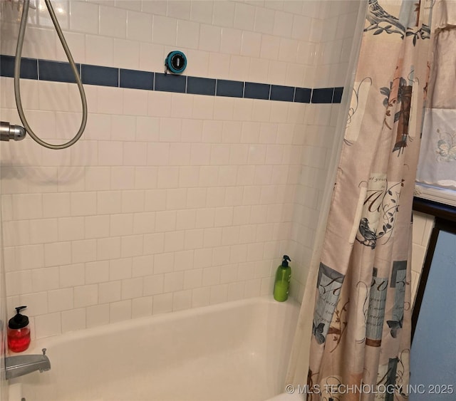 bathroom featuring shower / bath combination with curtain