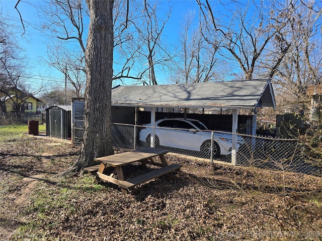 exterior space featuring a storage shed and a carport