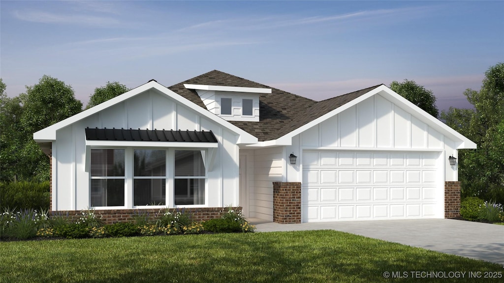 view of front facade with a garage and a lawn