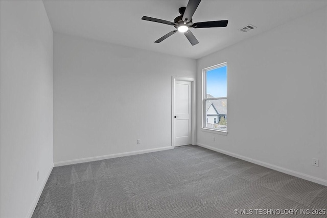 carpeted empty room featuring ceiling fan