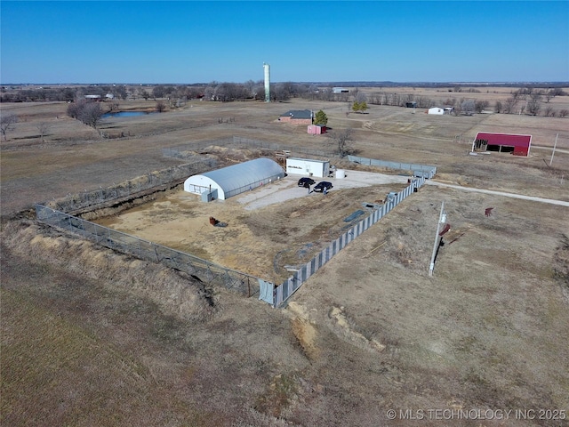 birds eye view of property featuring a rural view