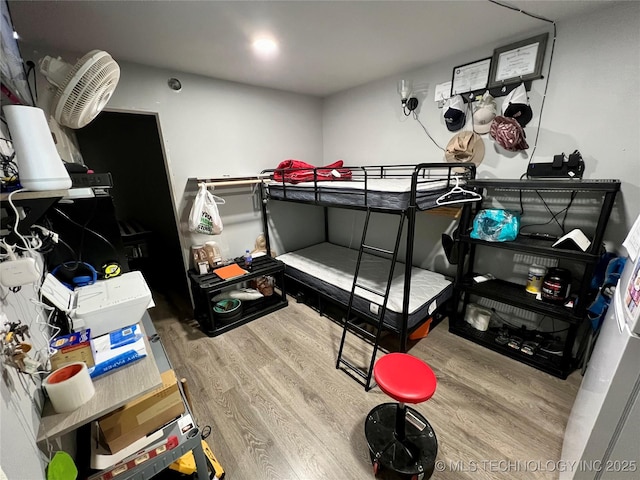 bedroom featuring hardwood / wood-style floors