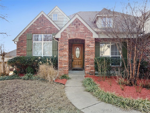 view of front of home featuring brick siding