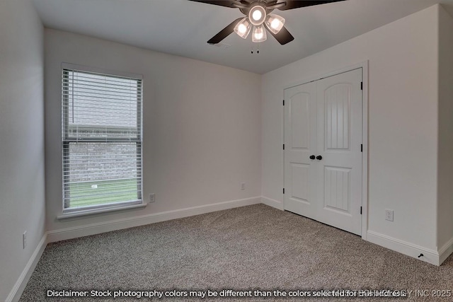 unfurnished bedroom with multiple windows, light colored carpet, a closet, and ceiling fan